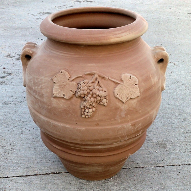 Terracotta jar with bunch of grapes handmade